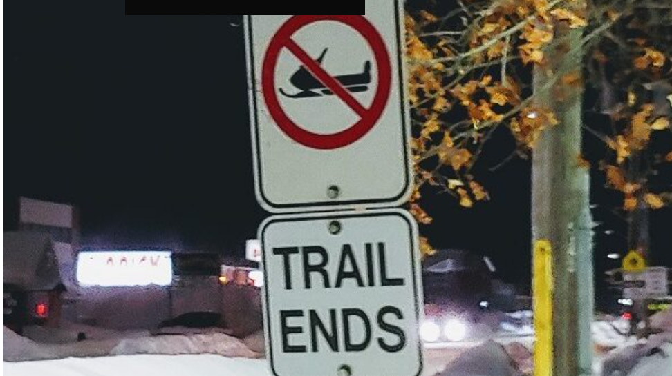 Snowmobile club busy packing area trails