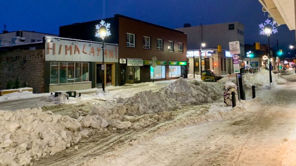 City removing snow from downtown area streets